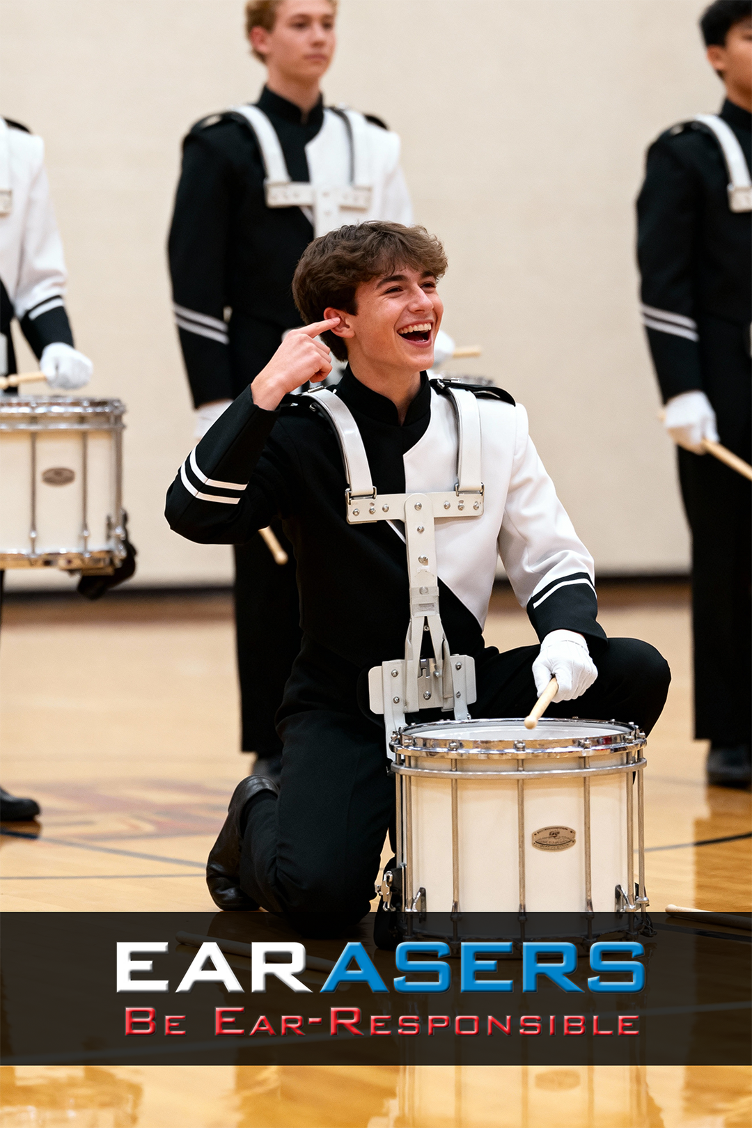 Person in a band uniform playing a drum with 'Earasers' advertisement at the bottom.