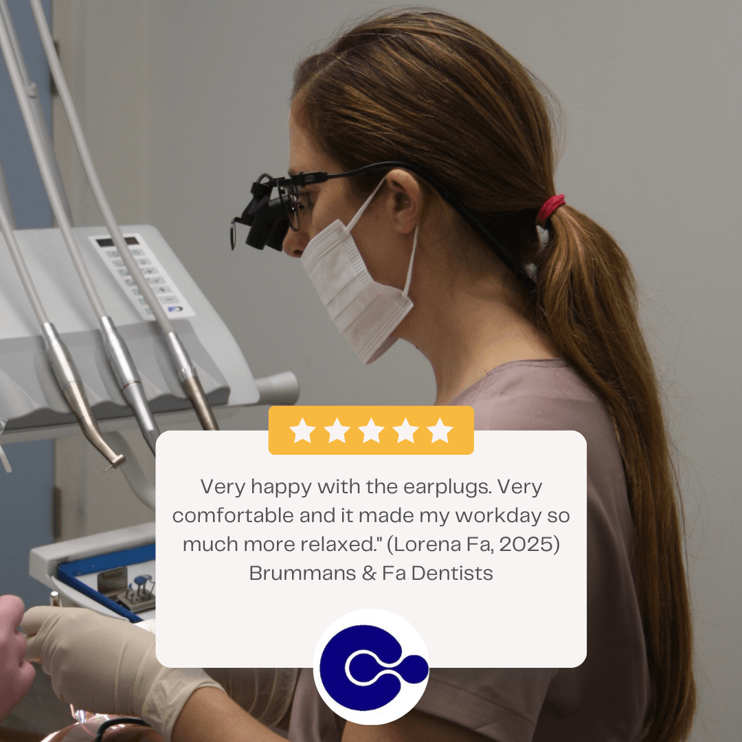 Left side profile of a woman in pink scrubs and a surgical mask and dental goggles. The caption shows 5 stars with the quotation "Very happy with the earplugs. Very comfortable and it made my workday so much more relaxed. (Lorena Fa, 2025) Brummans & Fa Dentists"