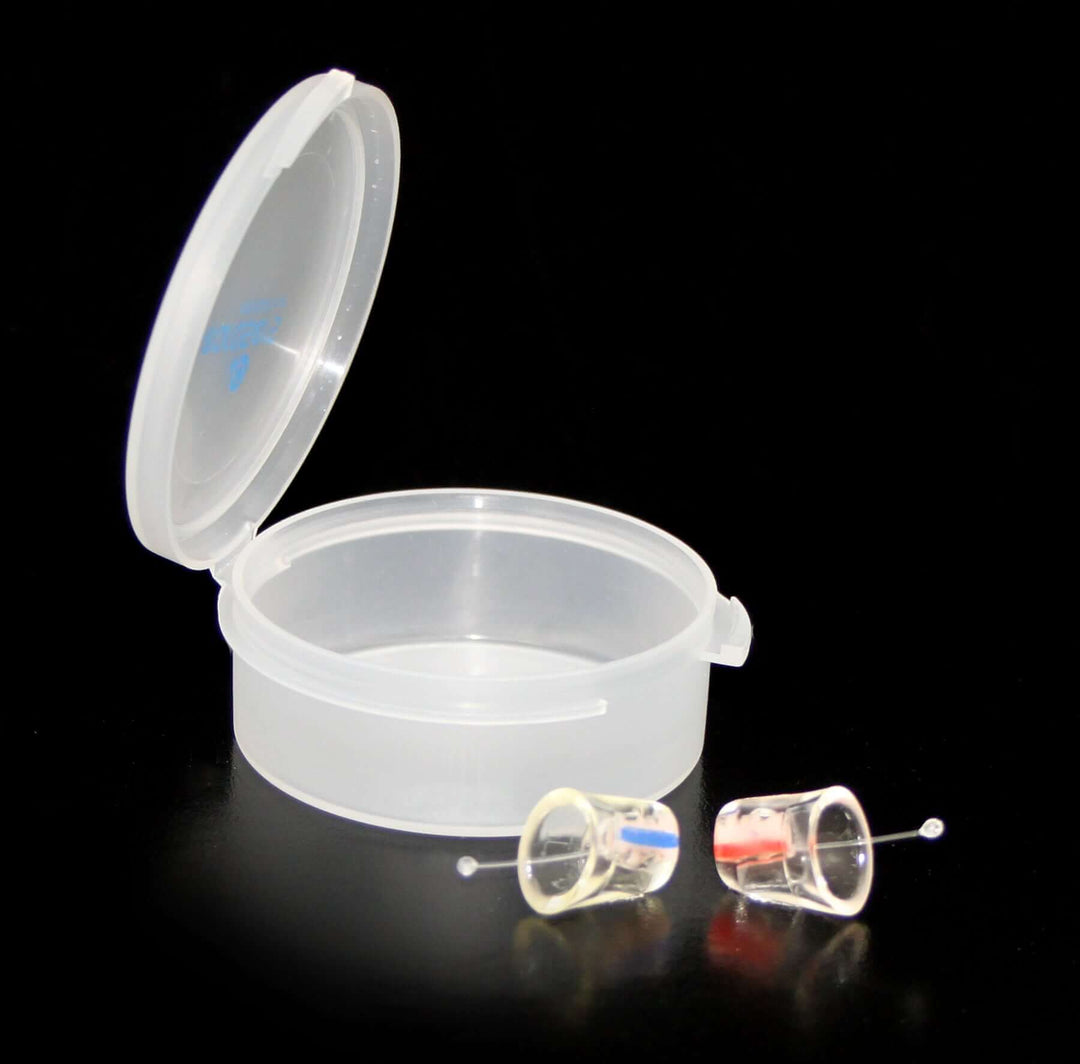 Earasers next to cup